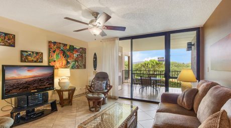 Family Room with a View - Enjoy sitting on the couch and playing a game of cards while listening to the breeze glide through the Hawaiian palms at Kamaole Sands 4-208.