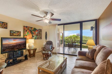 Family Room with a View - Enjoy sitting on the couch and playing a game of cards while listening to the breeze glide through the Hawaiian palms at Kamaole Sands 4-208.
