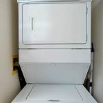 Stacked washer/dryer in unit