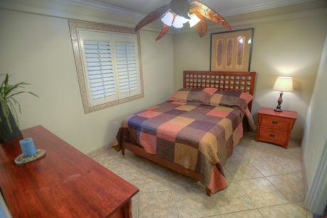 Haven of Relaxation - The master bedroom is a haven for you to unwind and relax after a long beach day. Keep cool under a circulating ceiling fan as you drift off to sleep reflecting on your day.