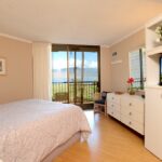 Watch the Sunset From the Primary Bedroom - Stretch out on our primary bed and watch a little TV, check out the ocean view from the patio entrance, check emails using Wi-Fi, or just catch a few zzz's.