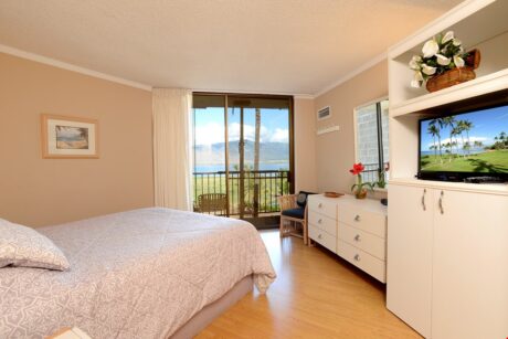 Watch the Sunset From the Primary Bedroom - Stretch out on our primary bed and watch a little TV, check out the ocean view from the patio entrance, check emails using Wi-Fi, or just catch a few zzz's.
