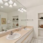 Luxurious Primary Bathroom - Between the expansive wall of mirrors, ample storage space, and relaxing shower, you will find the primary bathroom an invigorating place to end the day.