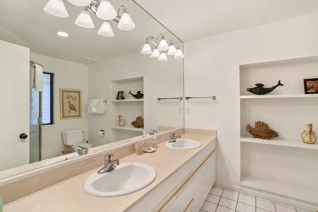 Luxurious Primary Bathroom - Between the expansive wall of mirrors, ample storage space, and relaxing shower, you will find the primary bathroom an invigorating place to end the day.