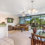 Family Room with a View - Enjoy sitting on the couch and playing a game of cards while listening to the breeze glide through the Hawai'i palms.