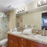 Dual vanities make the difference - This spacious bathroom has plenty of space for two to get ready for a day on the beach!