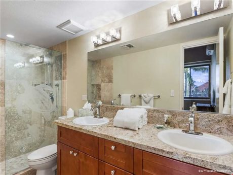 Dual vanities make the difference - This spacious bathroom has plenty of space for two to get ready for a day on the beach!