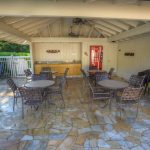 Family Bonding - Community Barbecue area with available covered seating for outdoor dining.