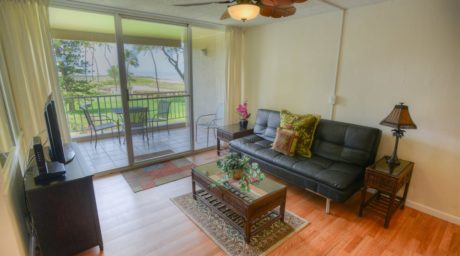 Easy Access - The living room provides quick and easy access to Menehune Shores 225’s balcony where you can sit and enjoy the cool breeze and share stories with a friend.