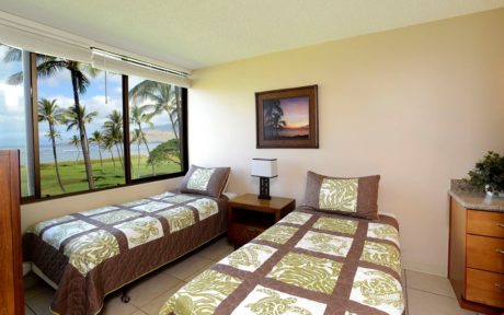 Guest Bedroom - This airy and welcoming guest bedroom has two twin beds, and of course amazing beachfront views!