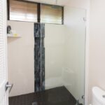 Enjoy a Cool Shower in the Bright and Clean Primary Bath! - The primary bathroom is the epitome of style and function. The walk-in glass shower is wonderful, but you'll also love all the space! Bath towels and linens are provided.