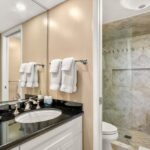 Primary En Suite - Step into the large shower for a quick wash up before you venture out for a golf outing, to swim in the pool, or beachcomb along the shore.