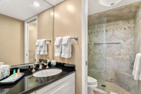 Primary En Suite - Step into the large shower for a quick wash up before you venture out for a golf outing, to swim in the pool, or beachcomb along the shore.