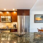 Plenty of Prep Space - An expansive granite-topped island provides lots of space for preparing food and organizing meals.