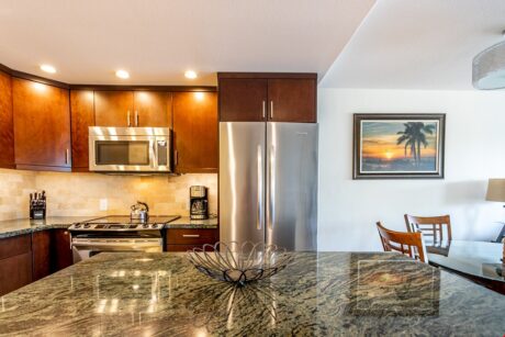Plenty of Prep Space - An expansive granite-topped island provides lots of space for preparing food and organizing meals.