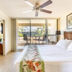 Perfect Relaxation - With a comfortable king-size bed, ceiling fan and sliding door access to the Maui Banyan H-302 balcony, the primary bedroom is a luxurious retreat.