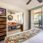 ate Paradise - Pull the pocket doors closed to create a private suite with a view of swaying palms out your sliding glass doors.