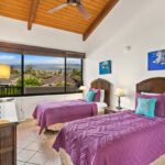 Second Bedroom - With twin beds and a glorious view of the Maui mountains, the second bedroom is a room guests will love claiming as their own.