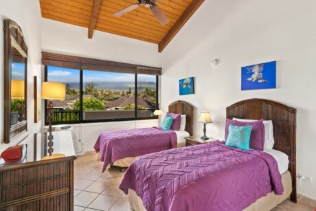 Second Bedroom - With twin beds and a glorious view of the Maui mountains, the second bedroom is a room guests will love claiming as their own.