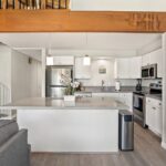Stylish Space - A large kitchen island gives you more than enough room for meal prep, and doubles as a buffet table where everyone can serve themselves.