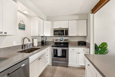 Stainless Style - The sleek, modern kitchen is equipped with stainless steel appliances (including an easy-clean, flat-top stove), as well as a microwave, toaster and blender.