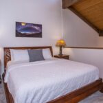 Serene Retreat - The king-sized bed in the primary bedroom is so inviting and comfortable, you’ll sleep like a baby as you dream of all the fun you’ll have in the day ahead.