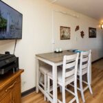Enjoy the dining table for four, smart TV, and wifi printer.